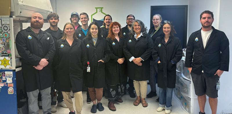 The Fidelity Diagnostics laboratory team wearing FIDI black lab coats