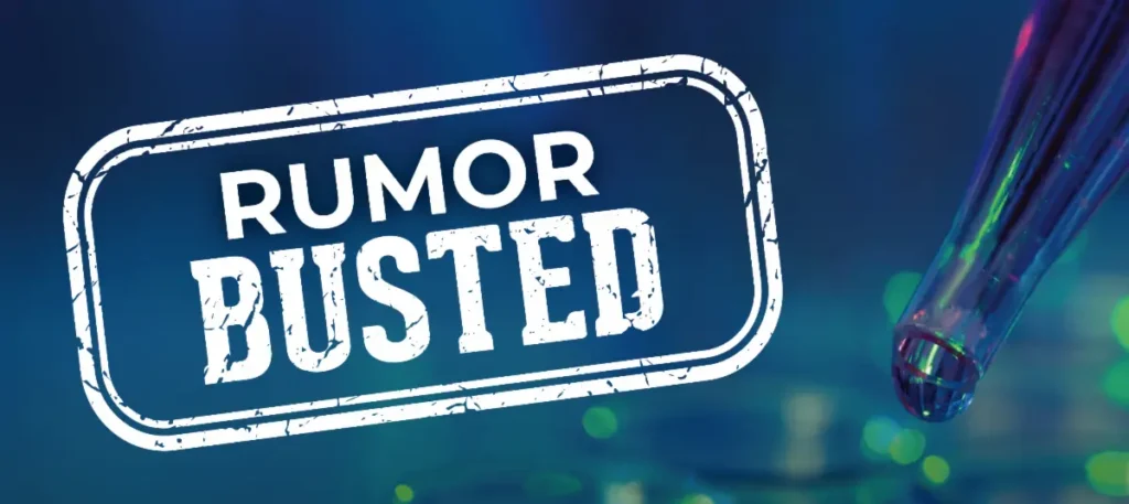 Close up shot of a test tube with a droplet on the tip and the text 'RUMOR BUSTED' on top